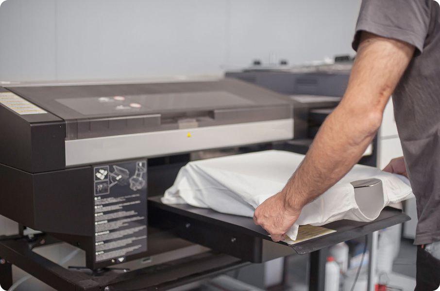 white t-shirt on printing machine