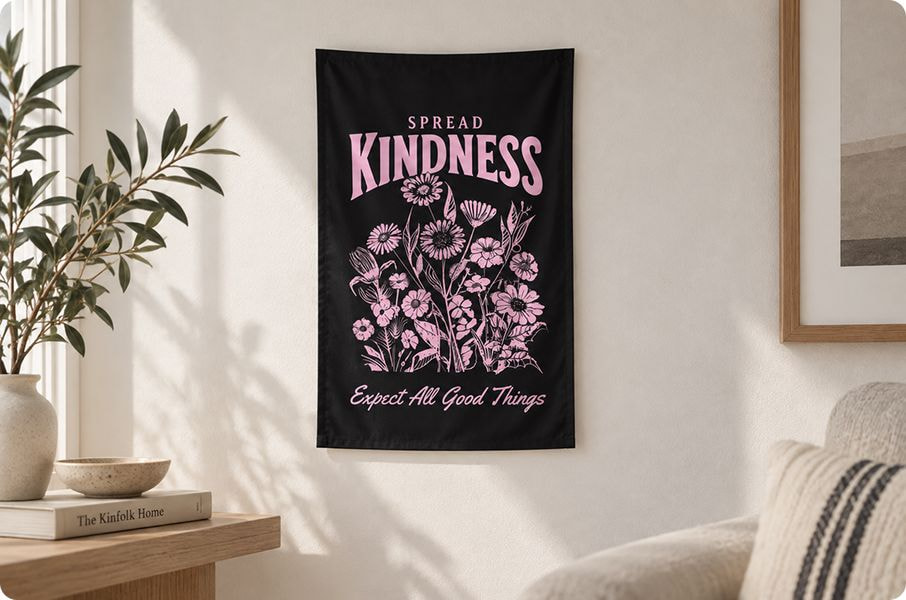 a black banner with pink flowers on a white wall