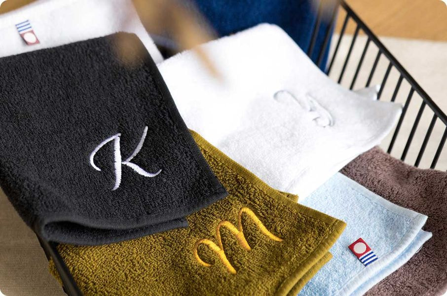a group of towels with a letter on them
