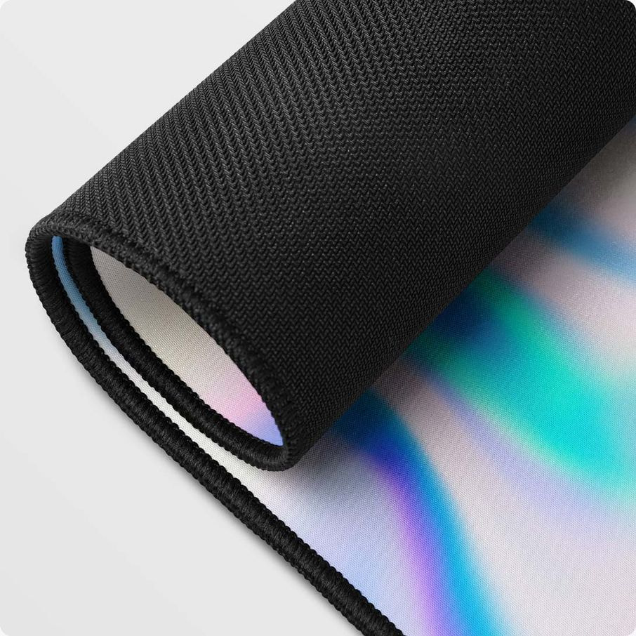 Close-up of a rolled mouse pad showing stitched black edges and textured backing for durability.