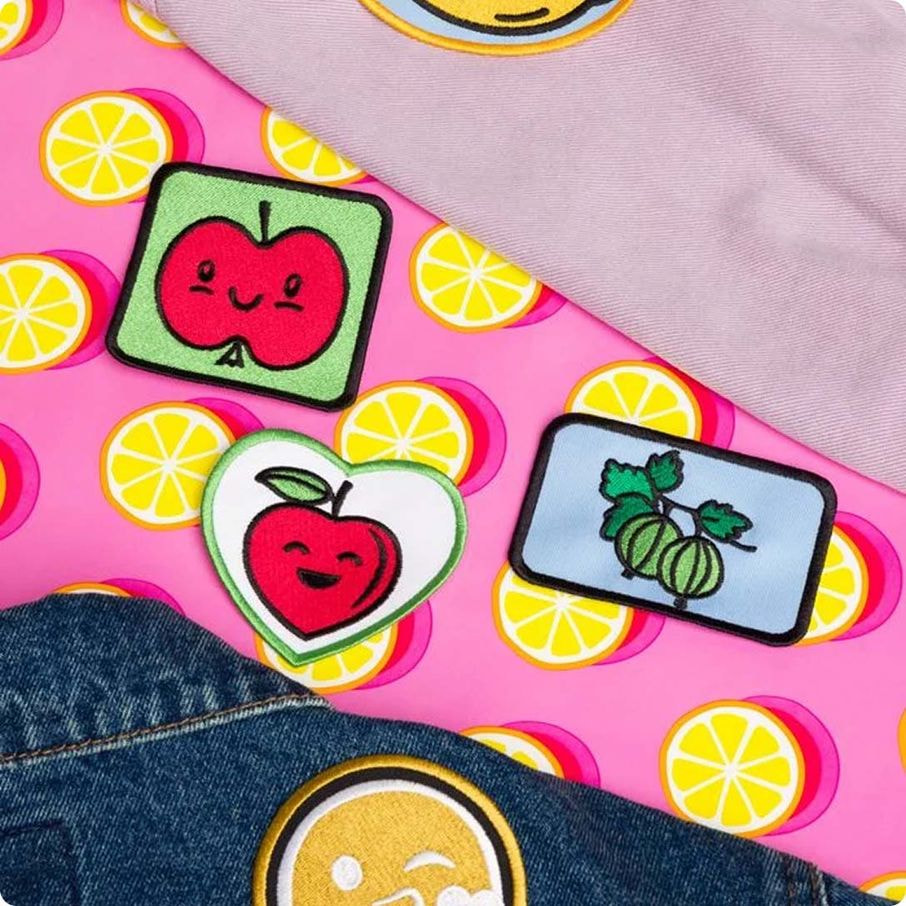 a group of patches on a pink surface