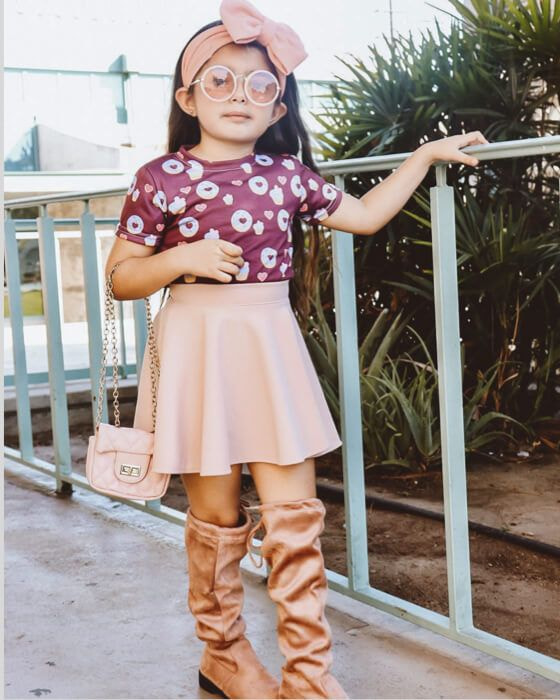 kid in custom printed all-over print shirt