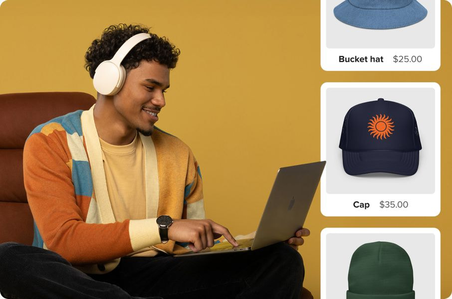 a man sitting on a chair with a laptop and headphones