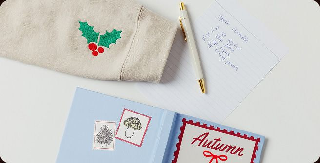 a notebook and pen on a table