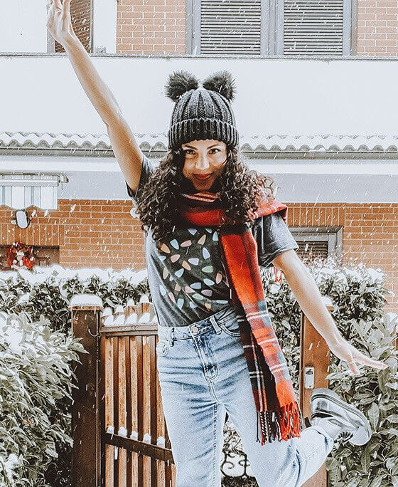 woman outside in winter in a t-shirt