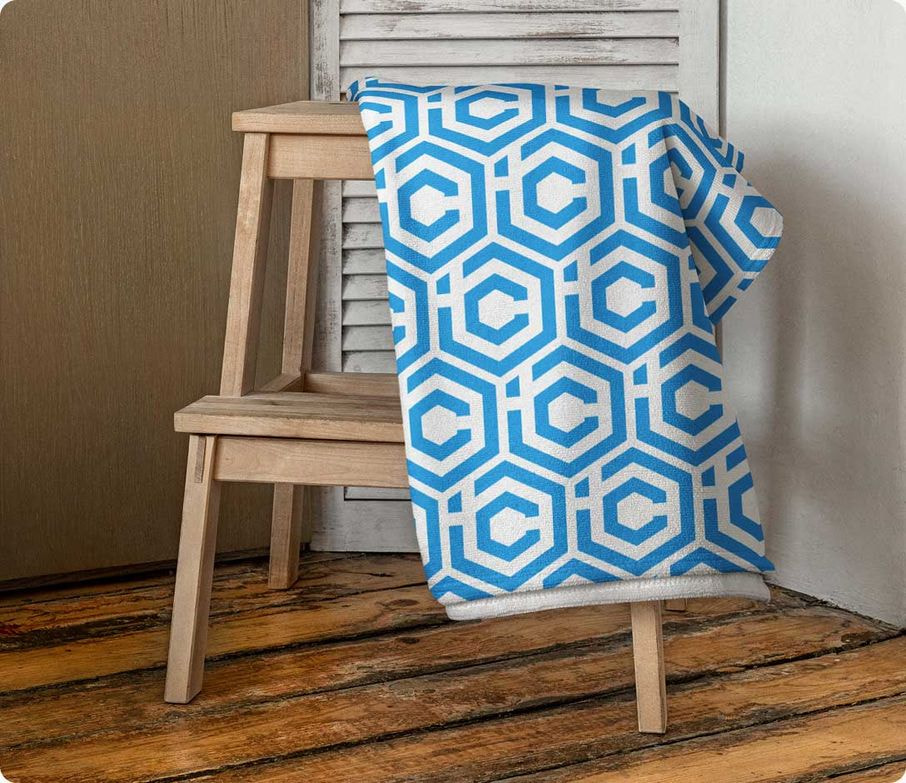 a blue and white blanket on a chair