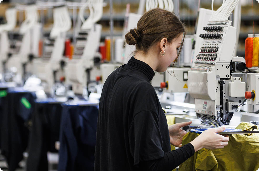 a woman working on a machine